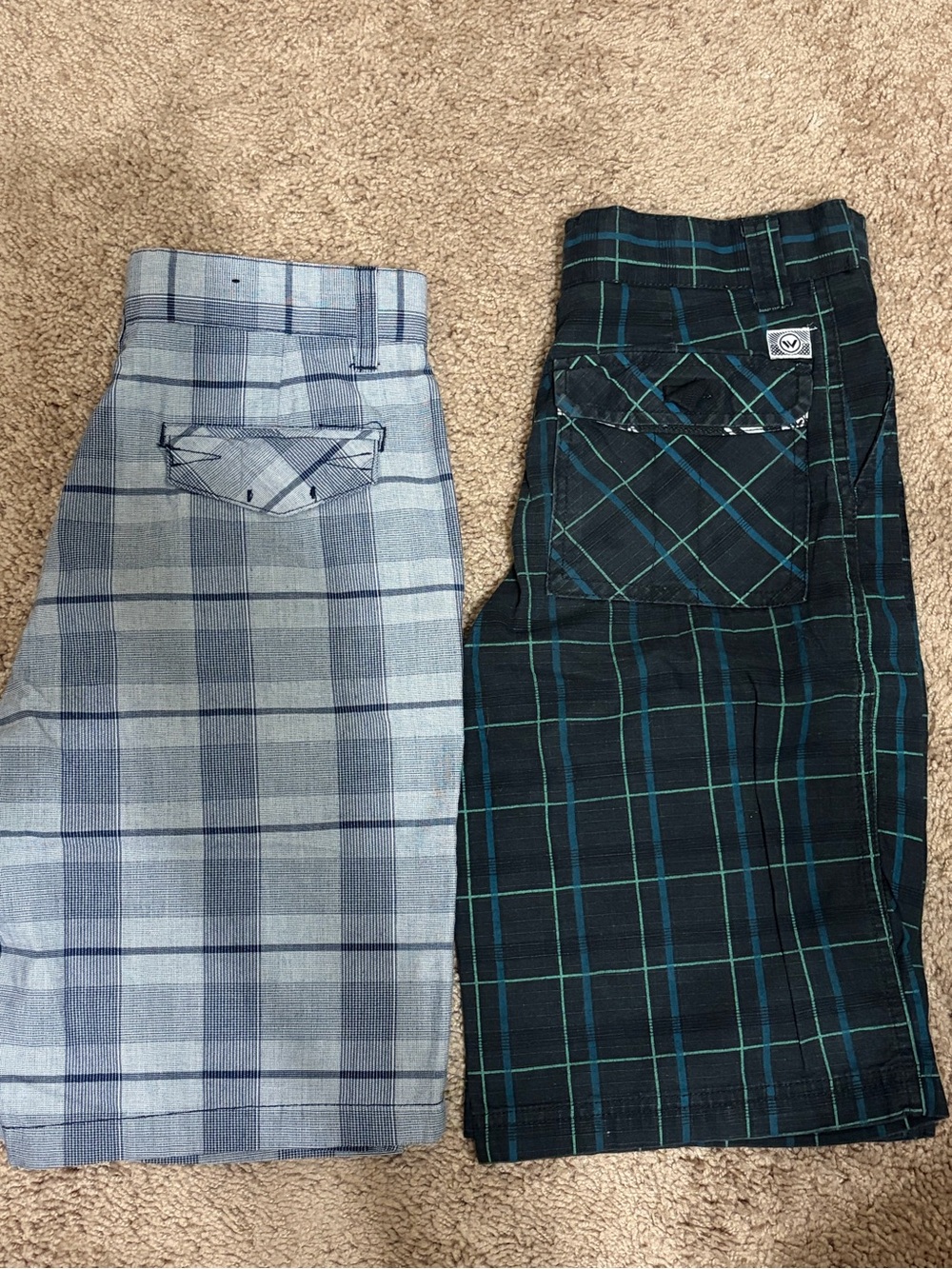 Two pairs of plaid shorts. Boys size 12 Micros and Shawn Hawk (122)